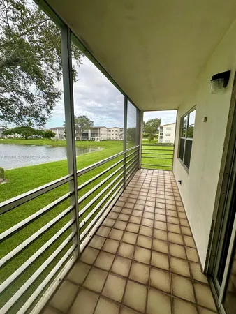 a view of a balcony with wooden floor
