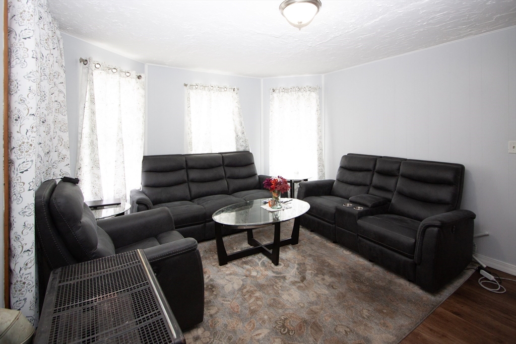 66 Cutler Street Worcester, MA 01604 - Photo 18 of 27 a living room with furniture and a window