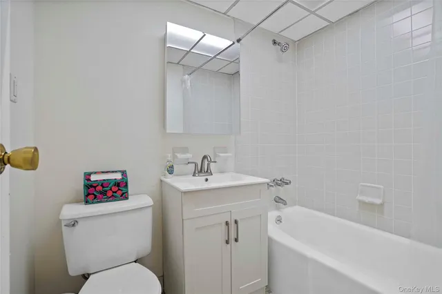 a bathroom with a sink toilet and a bathtub