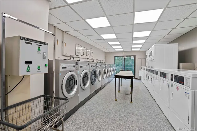 a view of a hallway with washer and dryer