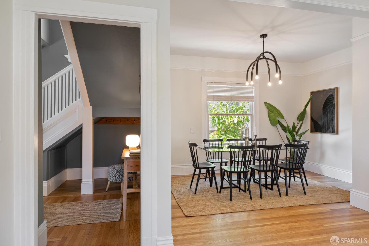 2341 Carleton Street Berkeley, CA 94704 - Photo 21 of 66 a view of a dining room with furniture window and wooden floor