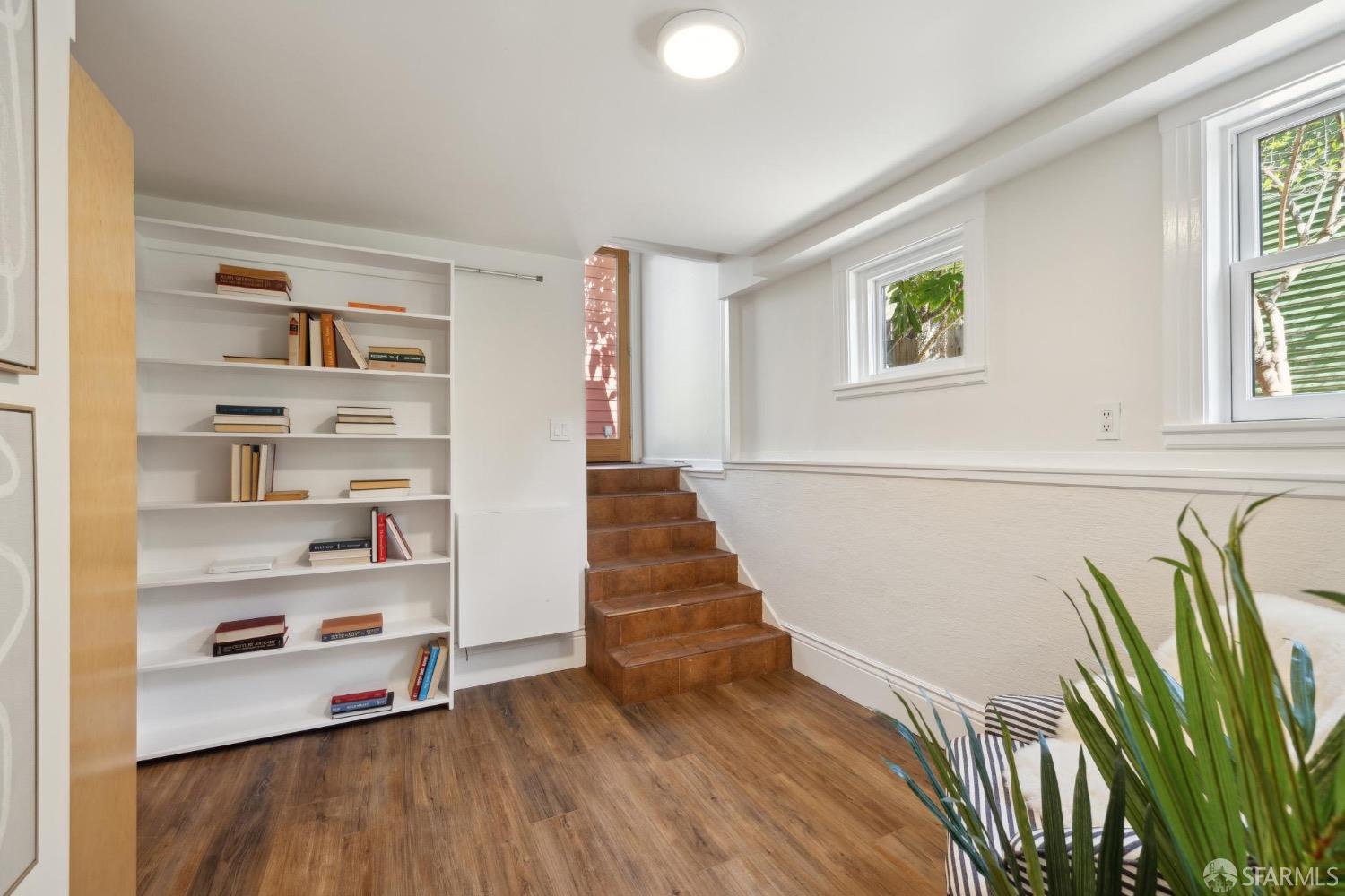 2341 Carleton Street Berkeley, CA 94704 - Photo 33 of 66 a living room with hard wood floors and a window