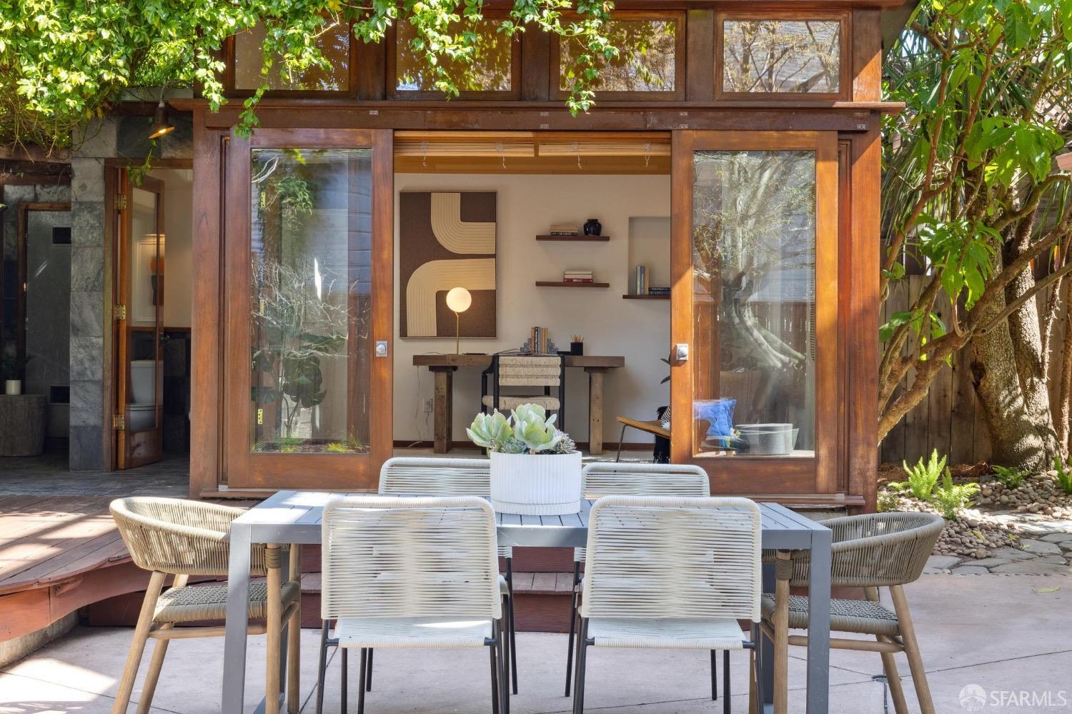 2341 Carleton Street Berkeley, CA 94704 - Photo 47 of 66 a view of an outside dining space with a table and chairs