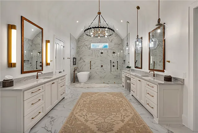 a living room with fireplace furniture and a large window