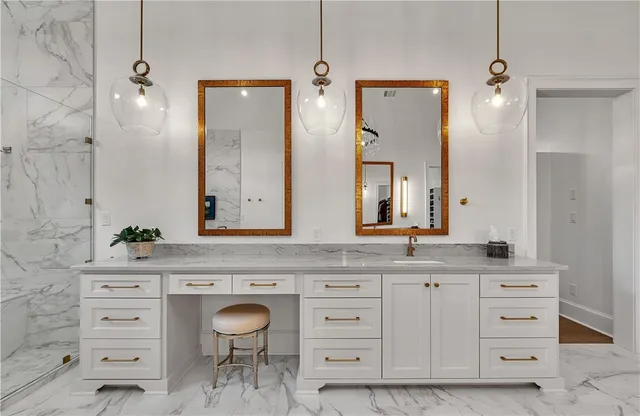 a living room with furniture a flat screen tv and a dining table with wooden floor