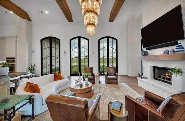 a large kitchen with stainless steel appliances a stove a sink dishwasher and cabinets with wooden floor