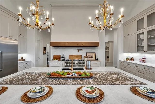 a kitchen with a sink cabinets and refrigerator