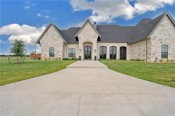 a view of a house with outdoor space and porch