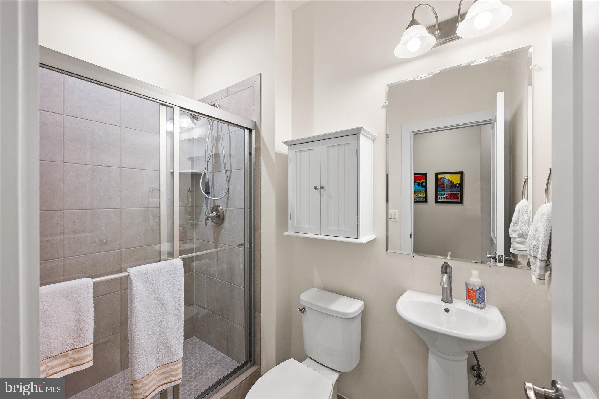 2236 South Glebe Road Arlington, VA 22206 - Photo 13 of 19 a bathroom with a sink toilet and shower