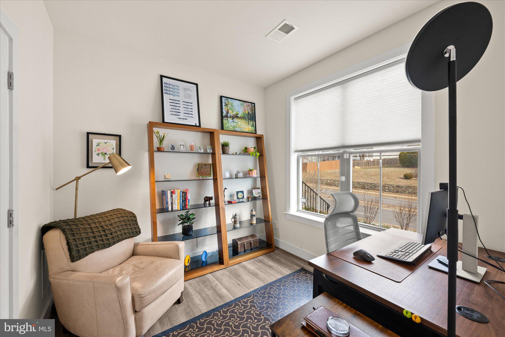2236 South Glebe Road Arlington, VA 22206 - Photo 15 of 19 a living room with furniture and a floor to ceiling window
