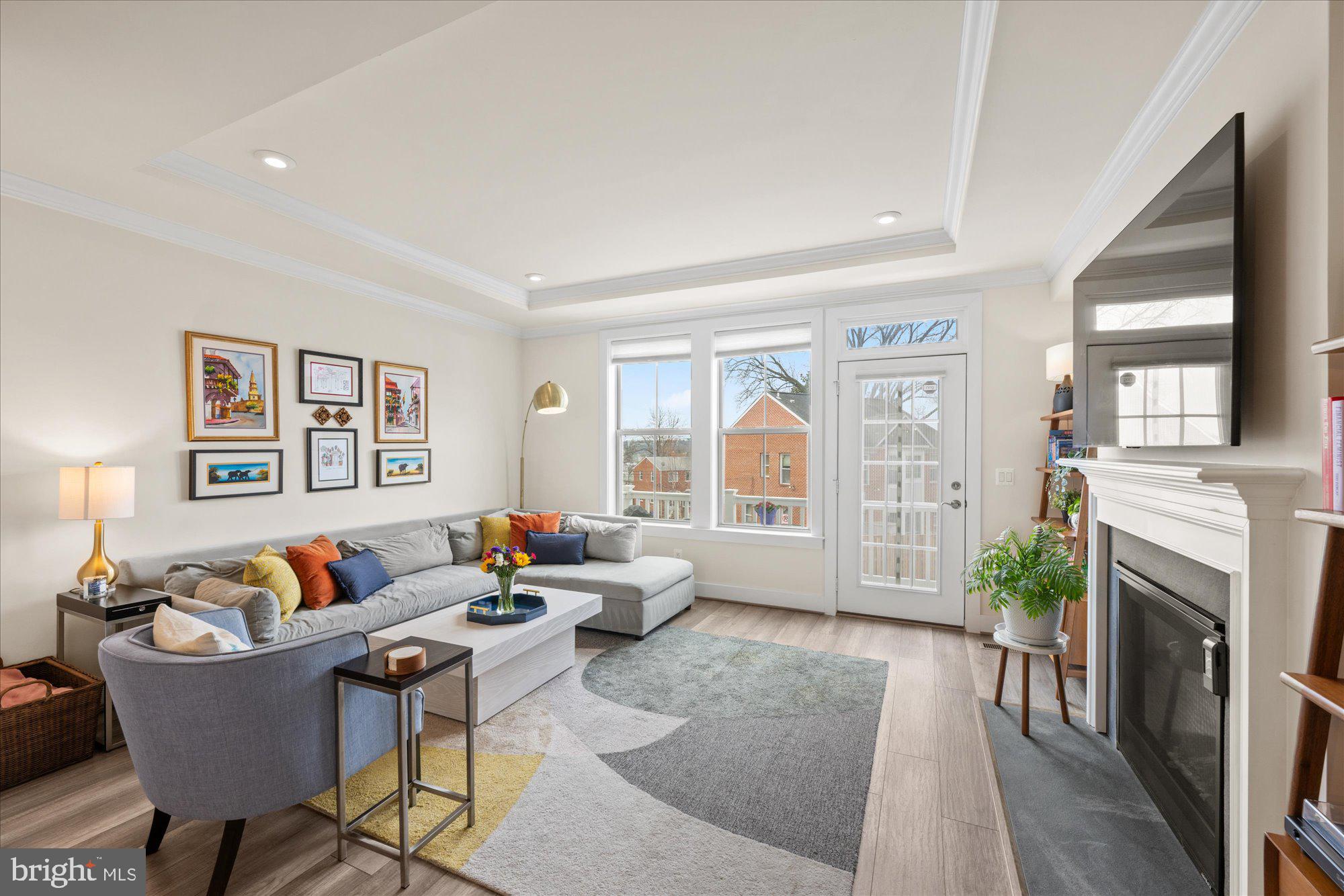 2236 South Glebe Road Arlington, VA 22206 - Photo 4 of 19 a living room with furniture fireplace and a large window