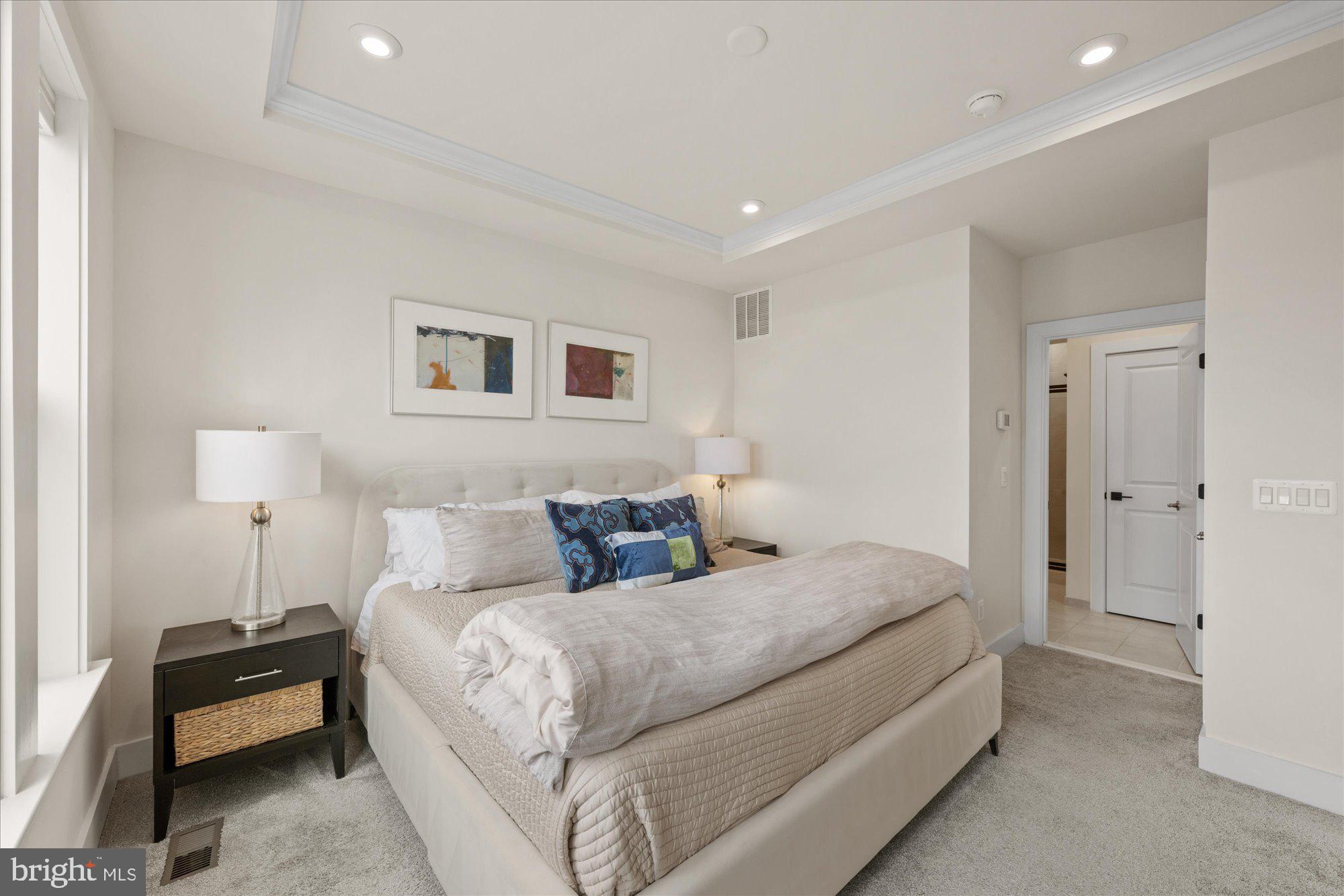 2236 South Glebe Road Arlington, VA 22206 - Photo 9 of 19 a bedroom with bed and a night stand on dresser