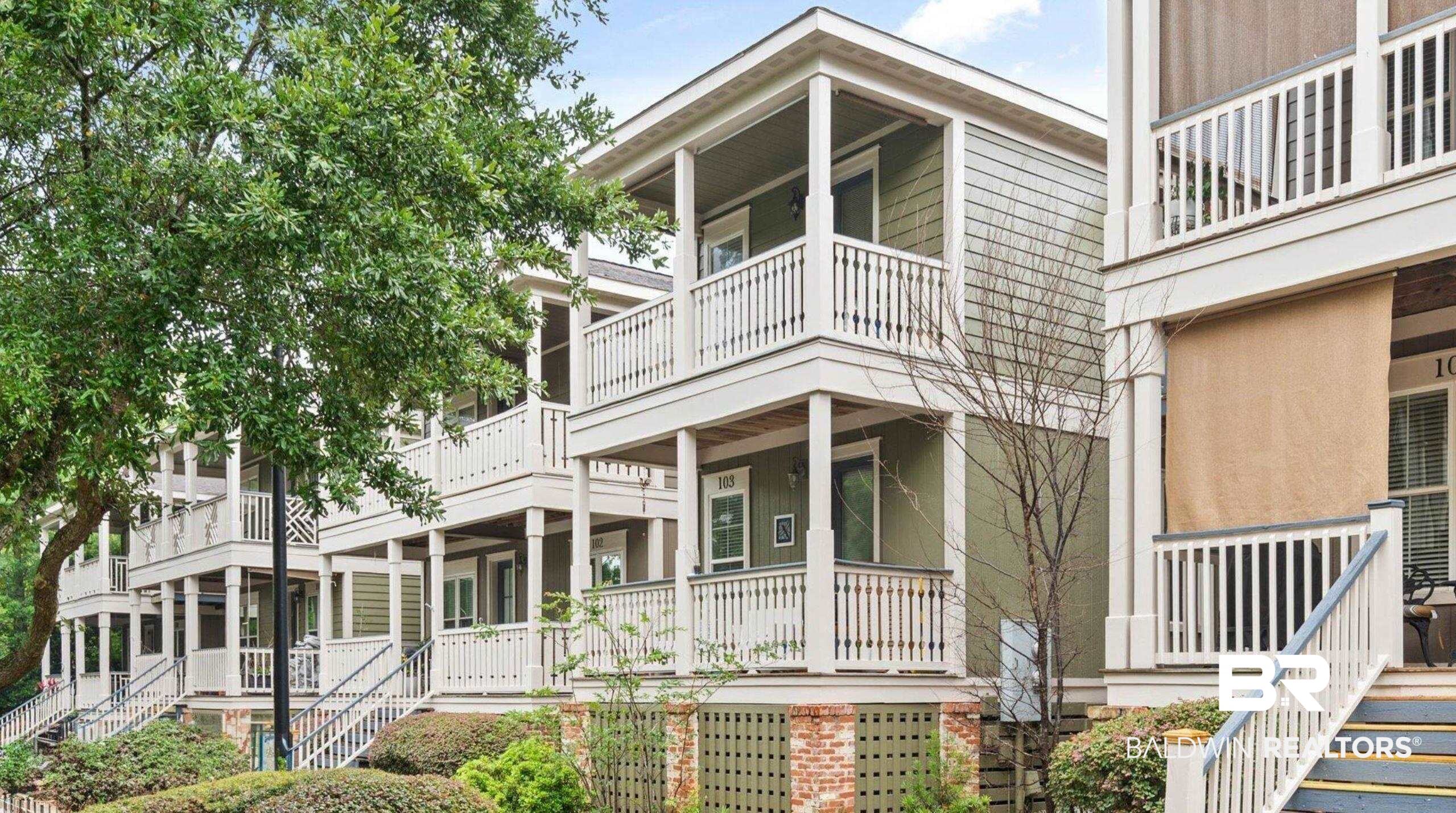 25806 Pollard Road, Unit 203 Daphne, AL 36526 - Photo 1 of 14 View of front of home with stairway, a porch, and a balcony