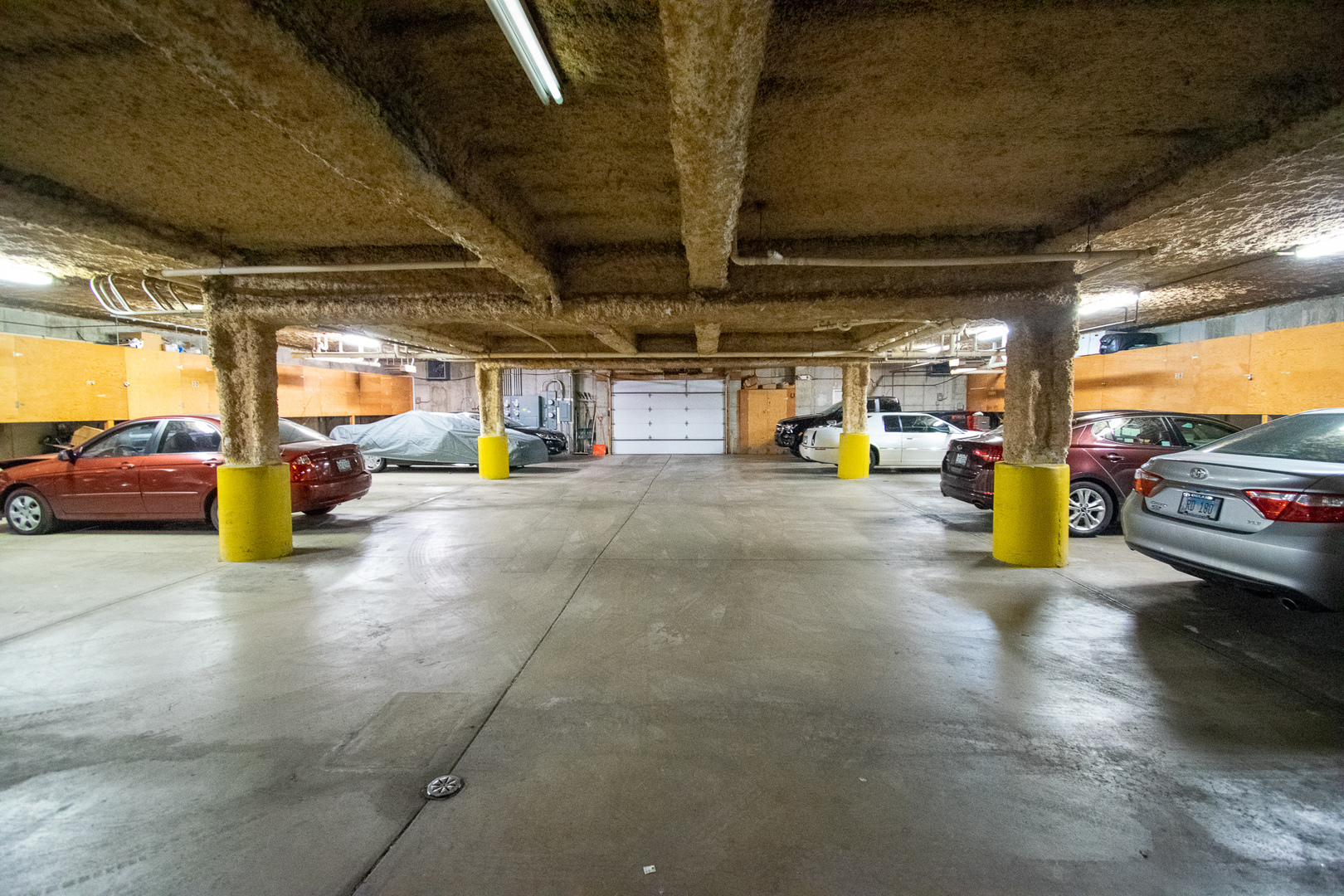 18300 Myrtle Court, Unit 3A Lansing, IL 60438 - Photo 2 of 20 a view of parking garage with cars