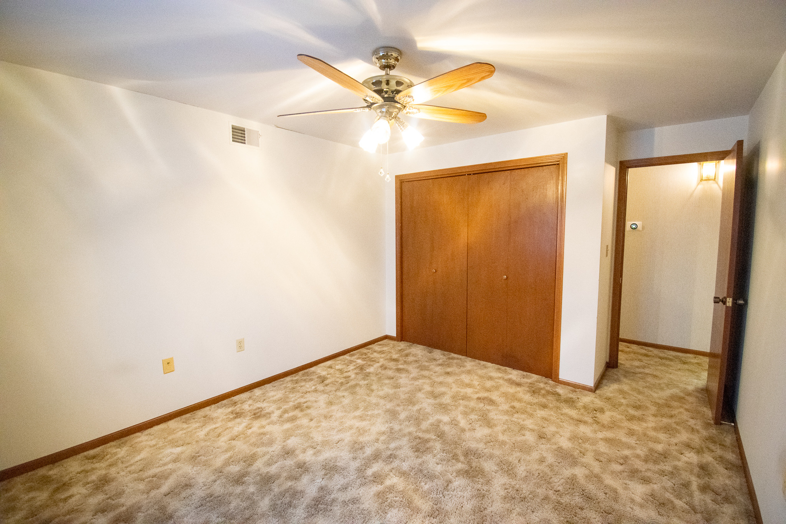 18300 Myrtle Court, Unit 3A Lansing, IL 60438 - Photo 9 of 20 an empty room with closet and a ceiling fan