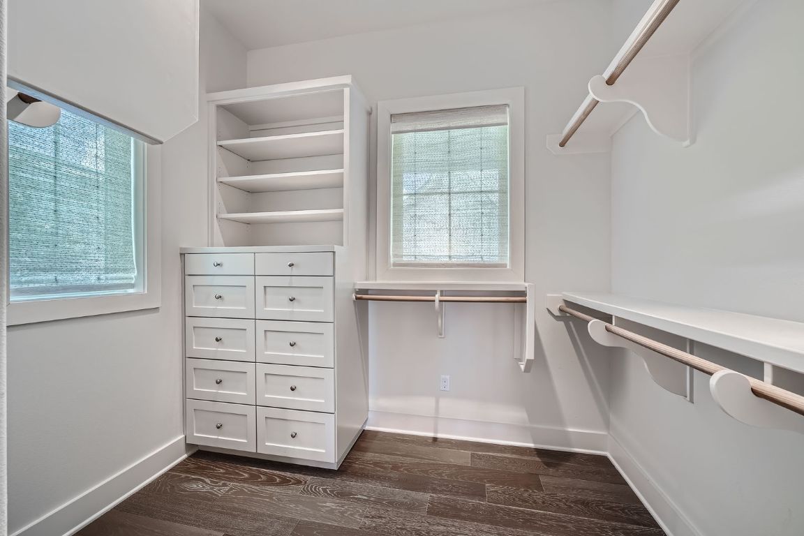 19517 Flying J Boulevard, Unit 8 Spicewood, TX 78669 - Photo 19 of 29 a view of walk in closet with empty racks