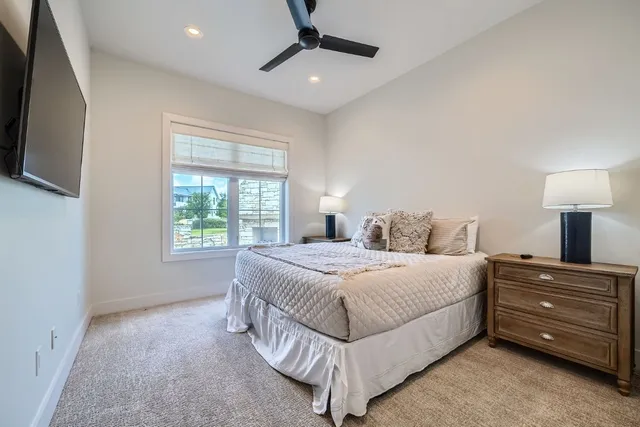 a bedroom with a bed and a tv