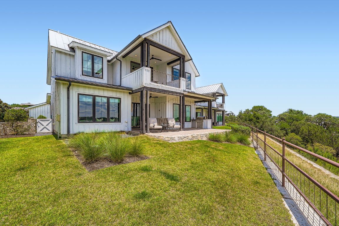 19517 Flying J Boulevard, Unit 8 Spicewood, TX 78669 - Photo 29 of 29 a view of a house with a swimming pool
