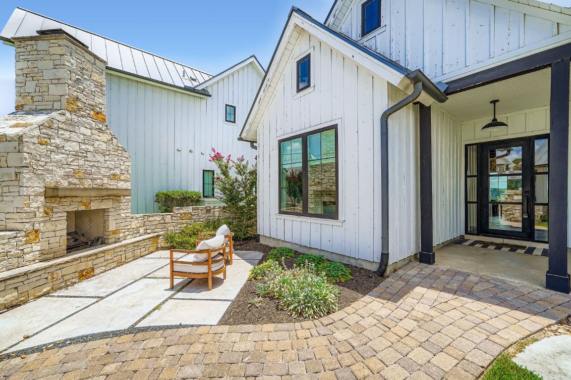 19517 Flying J Boulevard, Unit 8 Spicewood, TX 78669 - Photo 5 of 29 a view of a house with yard and sitting area