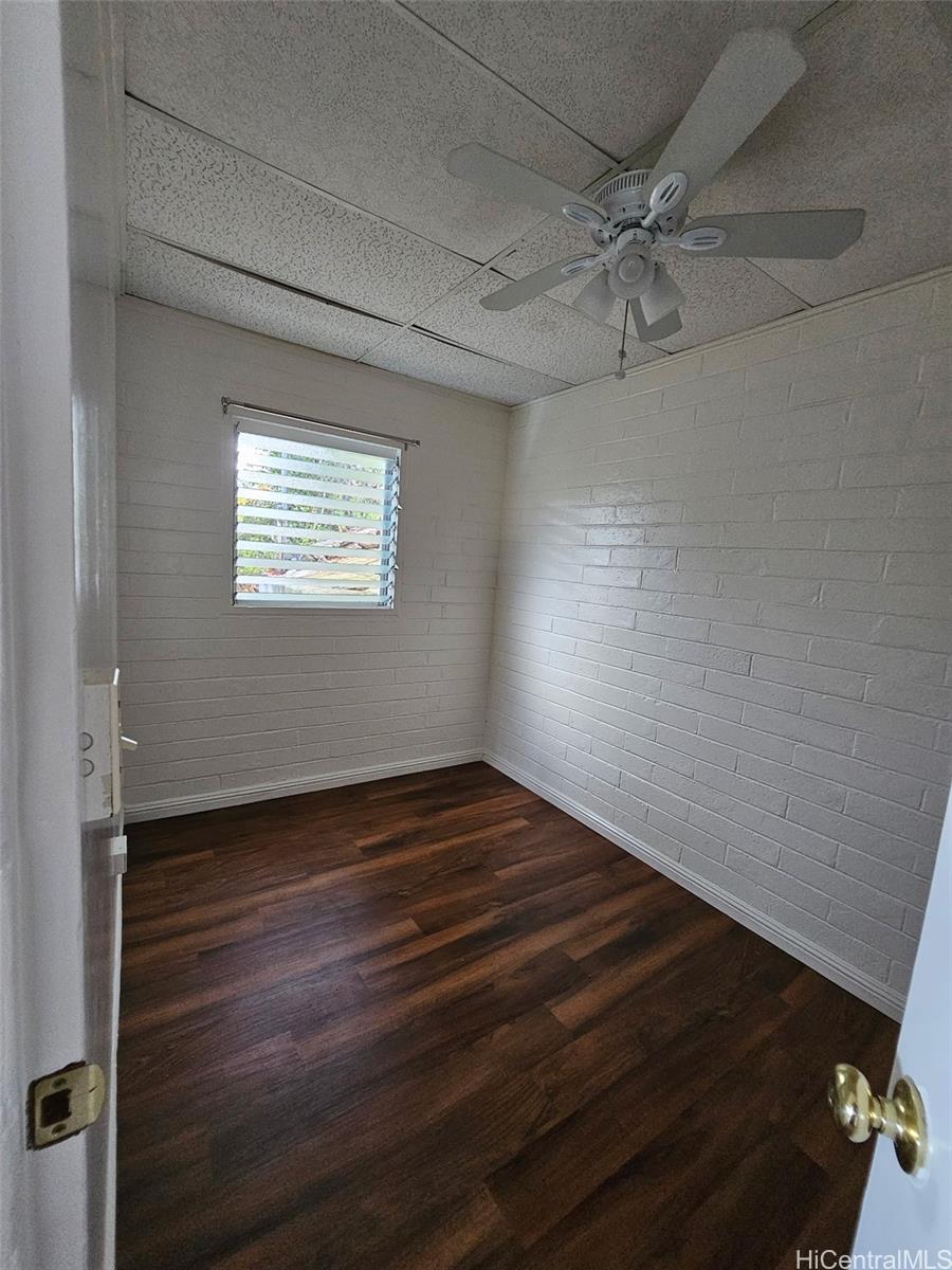 146 Prospect Street, Unit B Honolulu, HI 96813 - Photo 4 of 4 a view of an empty room with wooden floor and a window