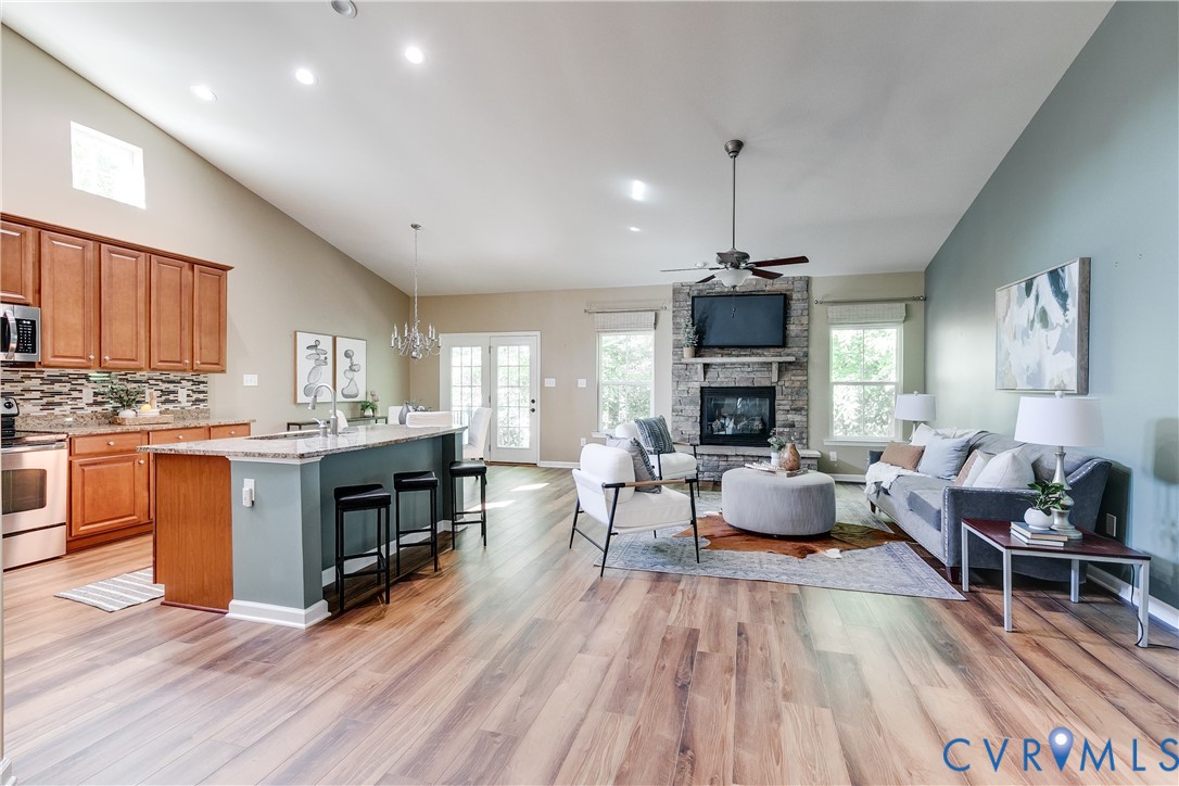 7538 South Franklins Way Quinton, VA 23141 - Photo 10 of 48 a living room with fireplace furniture and a wooden floor