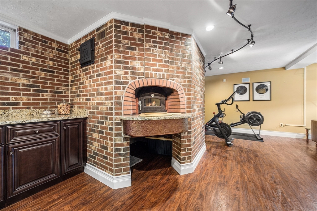 23 Landers Road Stoneham, MA 02180 - Photo 11 of 42 a living room with furniture and a fireplace