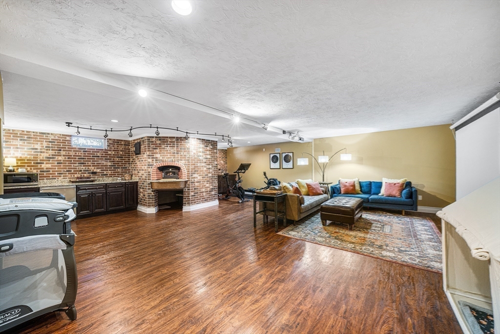 23 Landers Road Stoneham, MA 02180 - Photo 12 of 42 a living room with furniture and kitchen view
