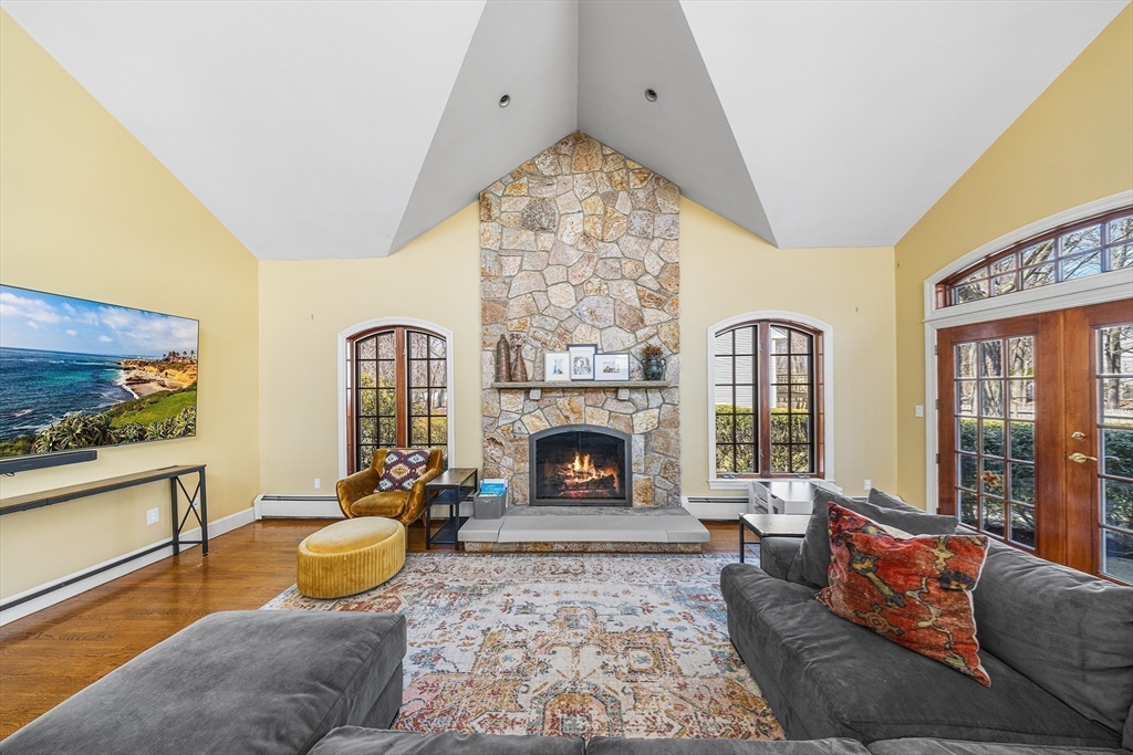 23 Landers Road Stoneham, MA 02180 - Photo 2 of 42 a living room with furniture large window and fireplace
