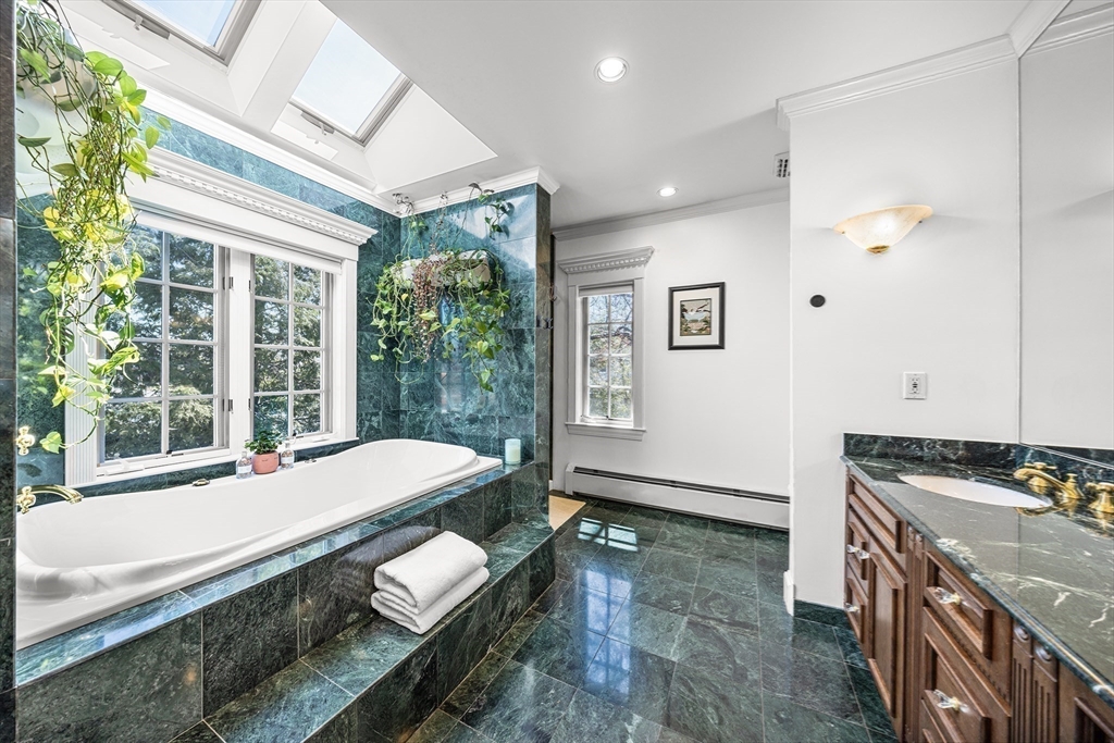 23 Landers Road Stoneham, MA 02180 - Photo 22 of 42 a living room with furniture and a large window