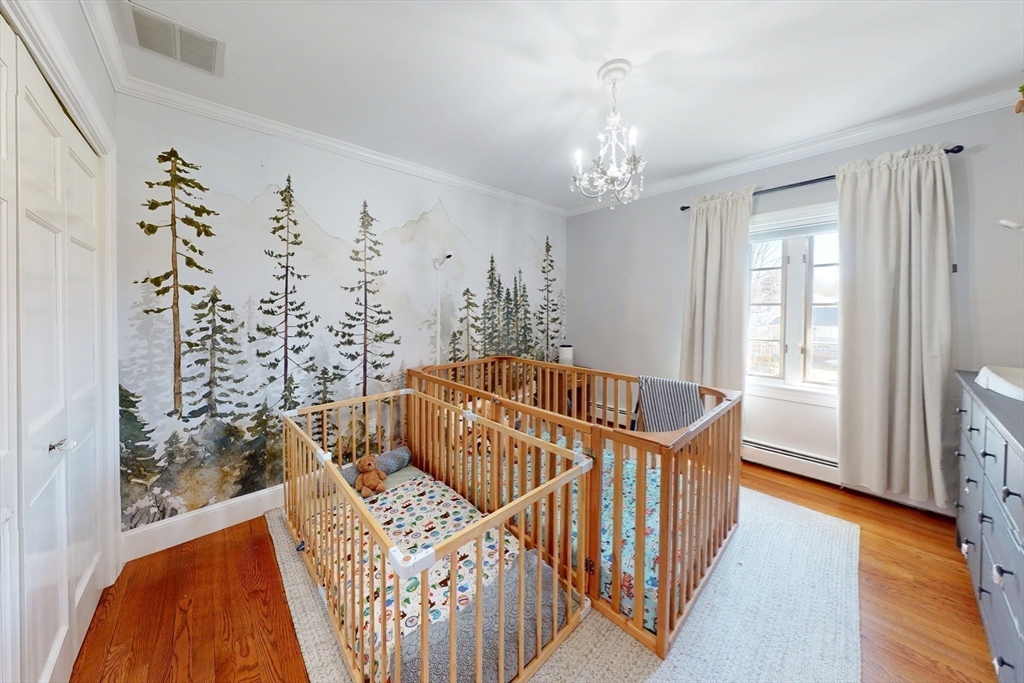 23 Landers Road Stoneham, MA 02180 - Photo 28 of 42 a view of a bedroom with wooden floor