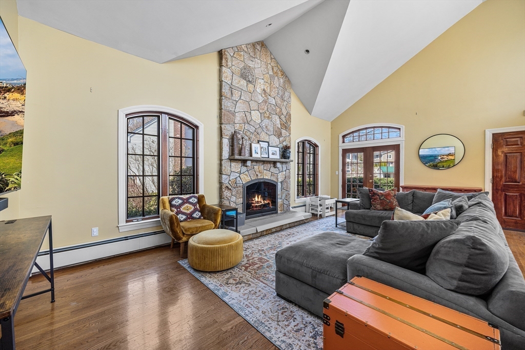 23 Landers Road Stoneham, MA 02180 - Photo 3 of 42 a living room with furniture window and a fireplace