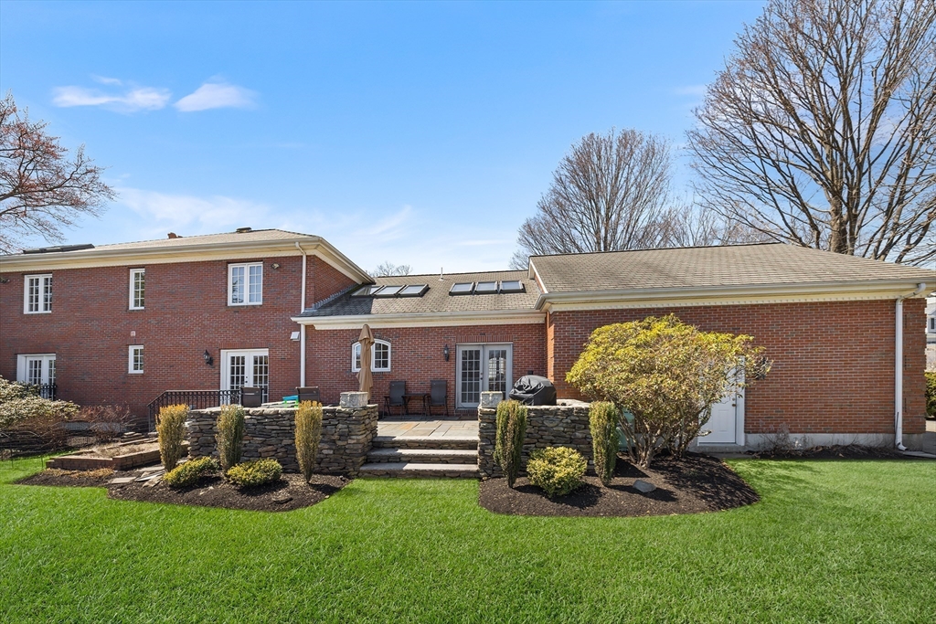 23 Landers Road Stoneham, MA 02180 - Photo 35 of 42 a front view of a house with garden
