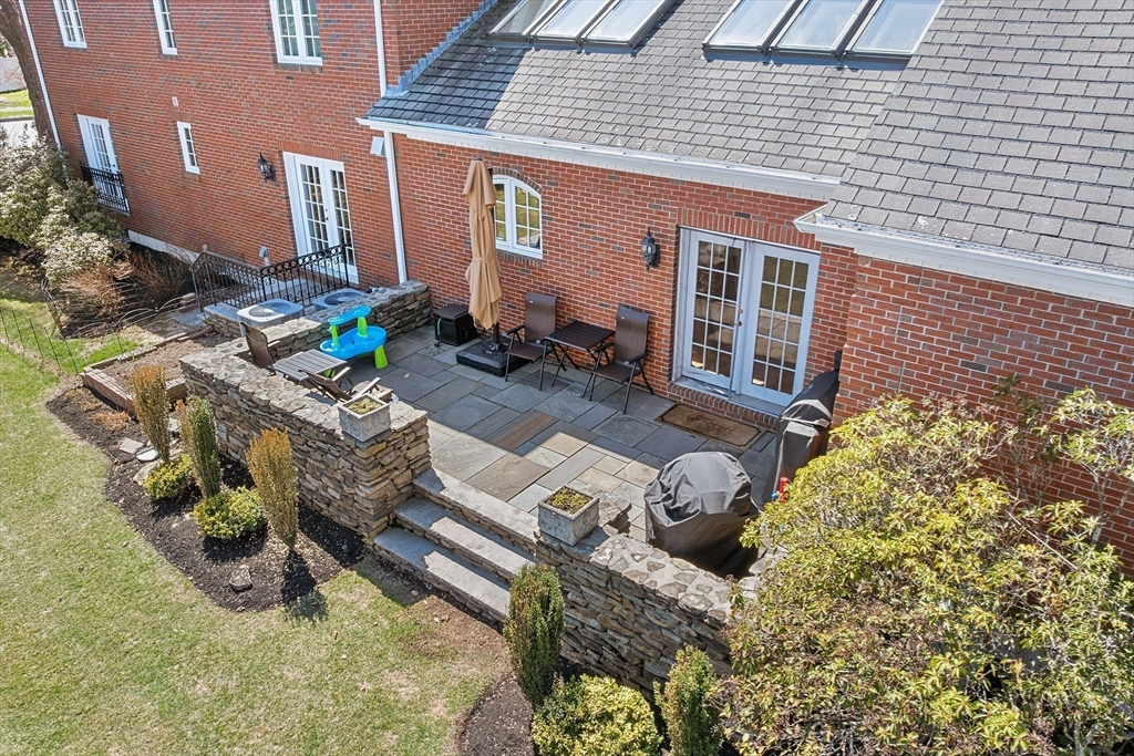 23 Landers Road Stoneham, MA 02180 - Photo 36 of 42 front view of a house with a patio