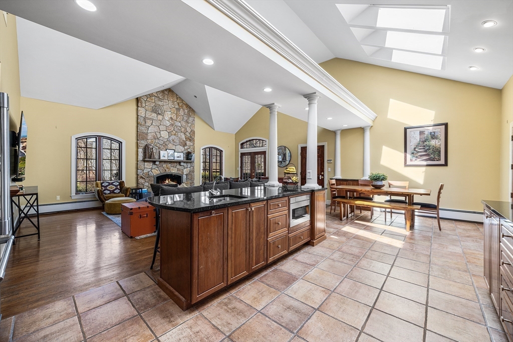 23 Landers Road Stoneham, MA 02180 - Photo 4 of 42 a living room with granite countertop furniture and a table