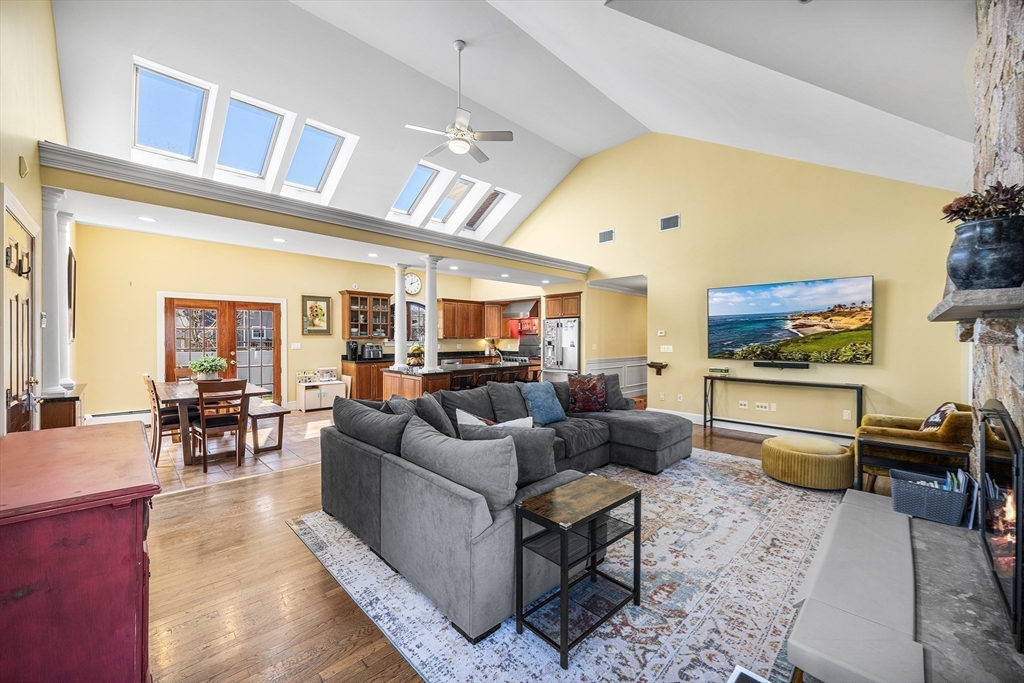 23 Landers Road Stoneham, MA 02180 - Photo 5 of 42 a living room with furniture and a flat screen tv