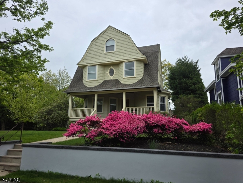 a front view of a house with yard