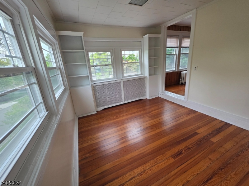 71 Montclair Avenue Montclair, NJ 07042 - Photo 14 of 25 a view of an empty room with wooden floor and a window