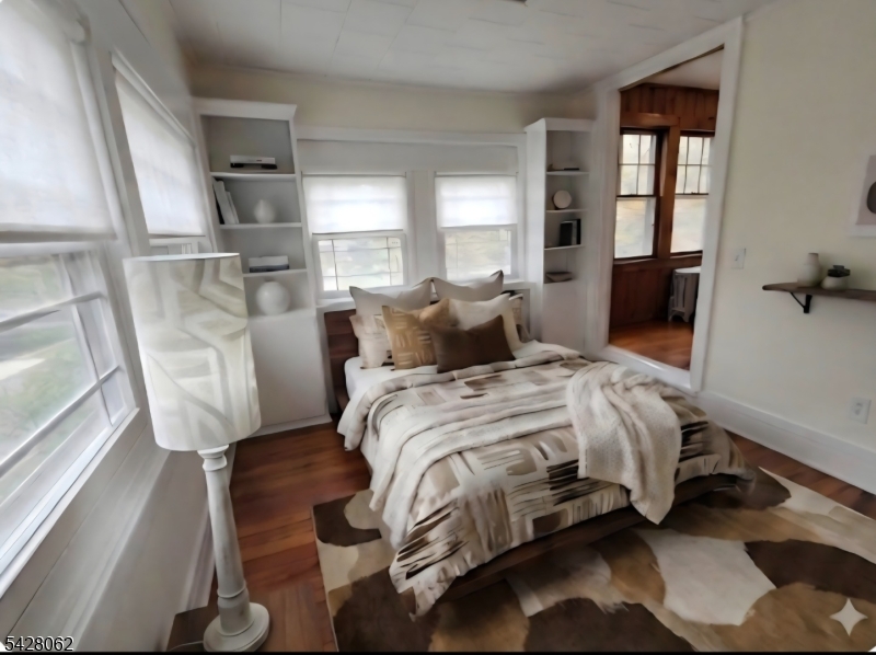 71 Montclair Avenue Montclair, NJ 07042 - Photo 15 of 25 a bedroom with a bed and wooden floor