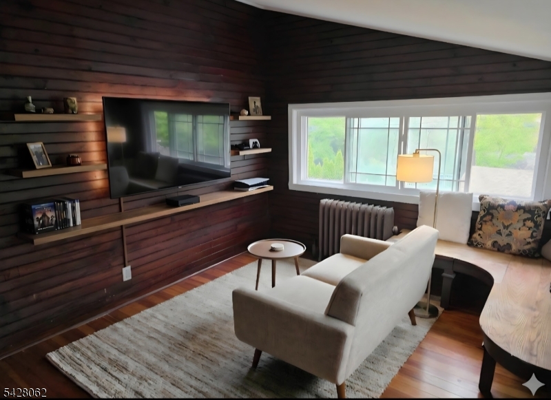 71 Montclair Avenue Montclair, NJ 07042 - Photo 18 of 25 a living room with furniture and a flat screen tv