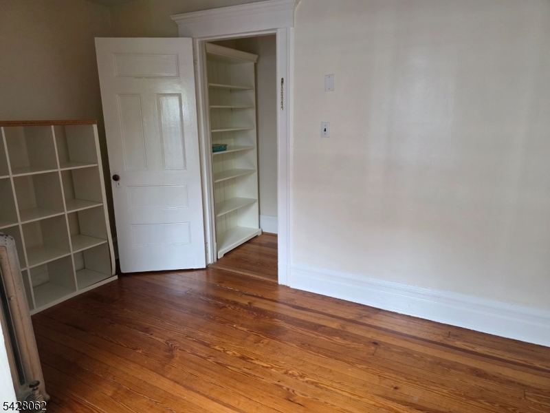 71 Montclair Avenue Montclair, NJ 07042 - Photo 19 of 25 a view of an empty room with wooden floor and a window