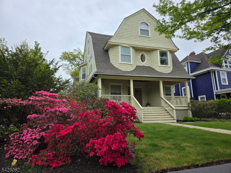 71 Montclair Avenue Montclair, NJ 07042 - Photo 2 of 25 a front view of a house with a yard