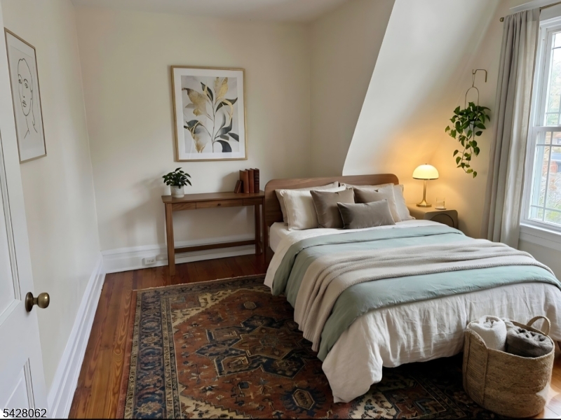 71 Montclair Avenue Montclair, NJ 07042 - Photo 21 of 25 a bedroom with a bed and wooden floor