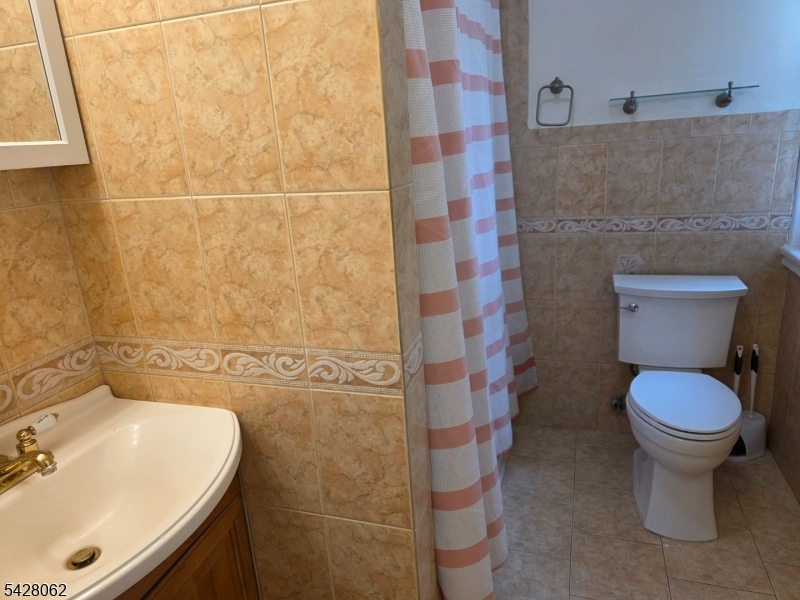 71 Montclair Avenue Montclair, NJ 07042 - Photo 23 of 25 a bathroom with a sink and toilet