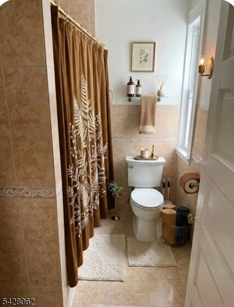 71 Montclair Avenue Montclair, NJ 07042 - Photo 24 of 25 a bathroom with a toilet and a shower curtain