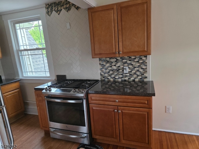 71 Montclair Avenue Montclair, NJ 07042 - Photo 9 of 25 a stove top oven sitting inside of a kitchen