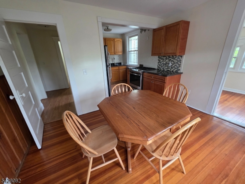 71 Montclair Avenue Montclair, NJ 07042 - Photo 10 of 25 a view of a dining room with furniture and wooden floor