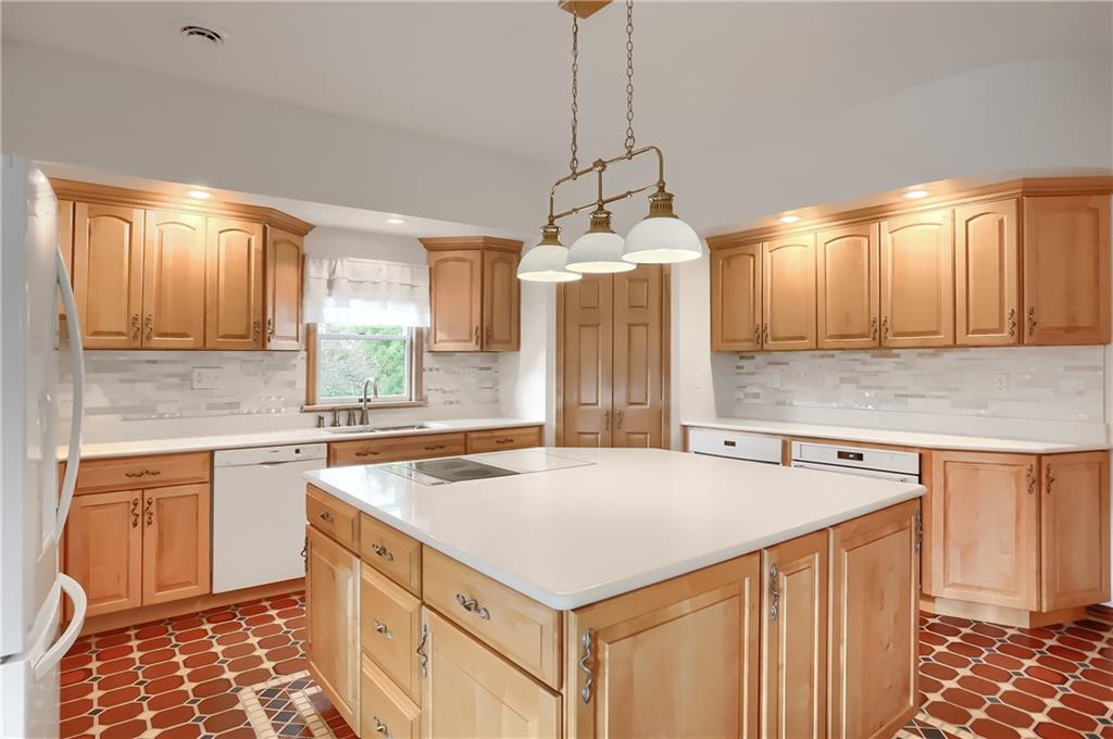 180 Brandon Road Slippery Rock, PA 16057 - Photo 18 of 50 Large Main Chef's Kitchen with an electric cooktop/griddle, built in exhaust system, and two additional ovens.