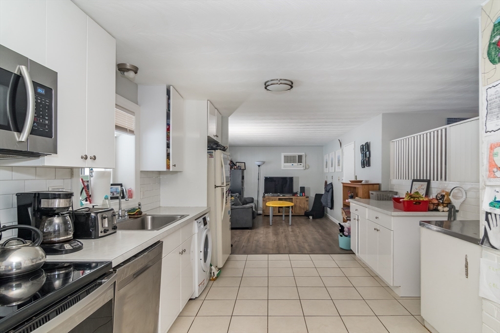 17 Francine Road Framingham, MA 01701 - Photo 6 of 14 a kitchen with stainless steel appliances a sink stove and cabinets