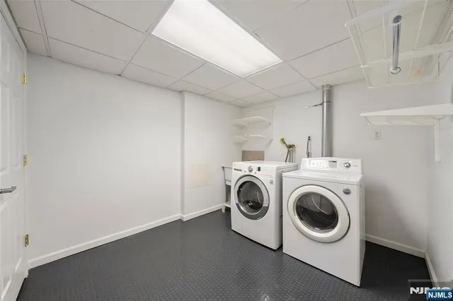 an aerial view of a house with parking space