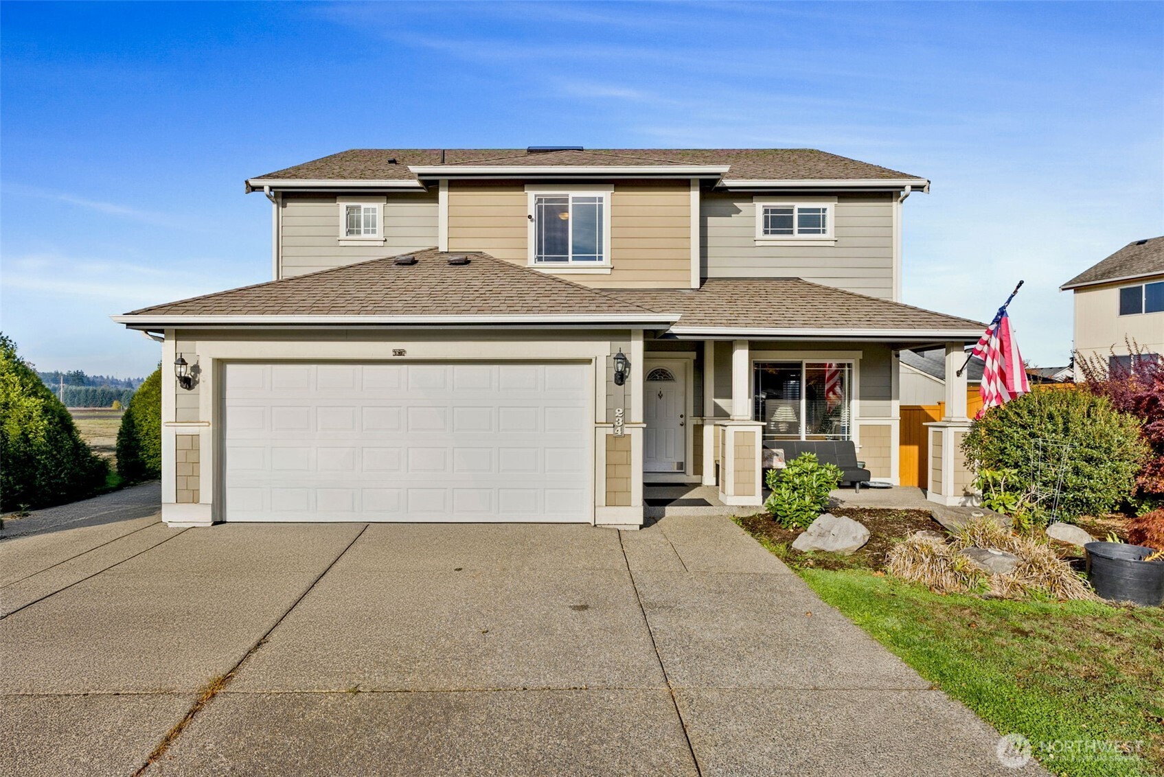 234 Wind River Drive Chehalis, WA 98532 - Photo 1 of 33 a front view of a house with a yard and garage
